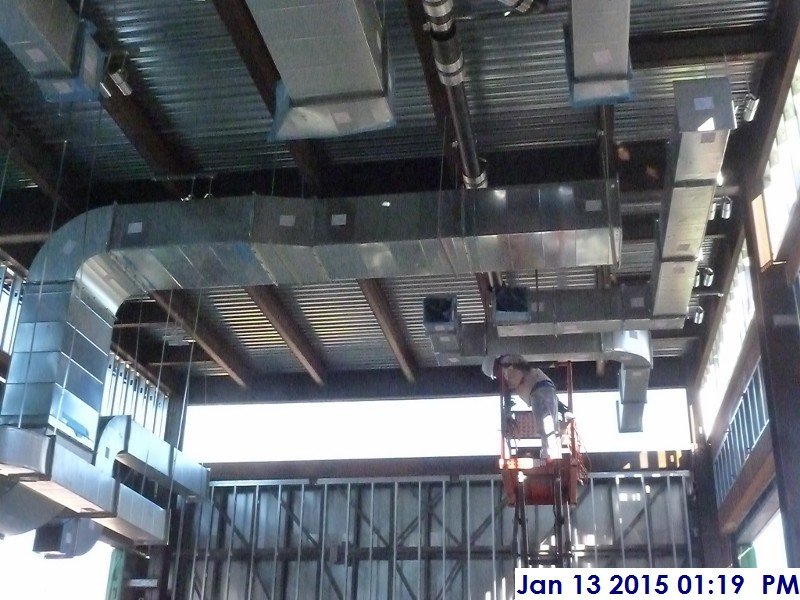 Installing duct work at the 4th floor Facing East